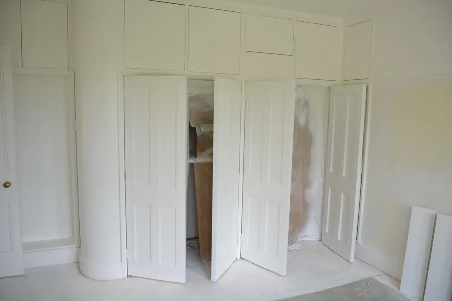 Fitted wardrobe doors hand-finished in white