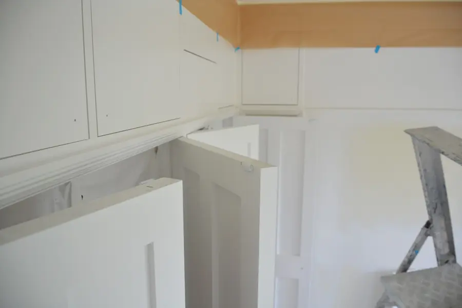 Spray-finished cabinet doors ready for re-hanging