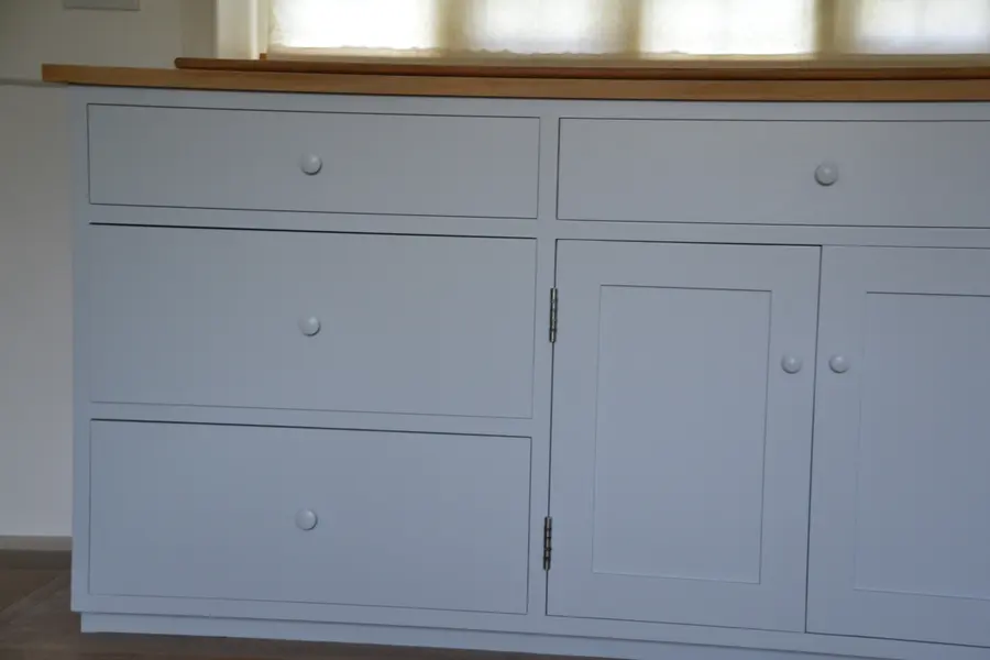 Close-up of resprayed kitchen drawers and cupboards in grey