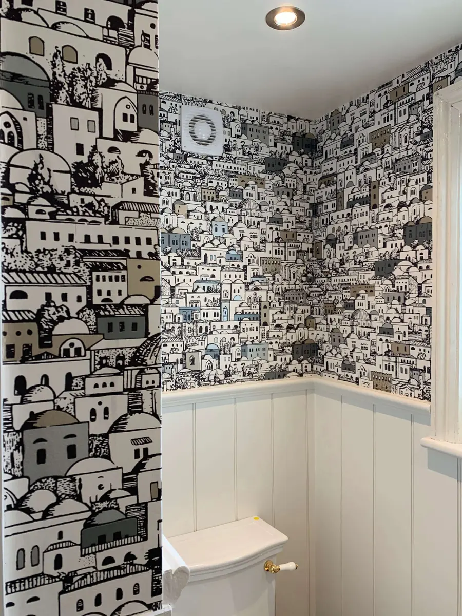 Wallpapered bathroom with a crisp, even finish