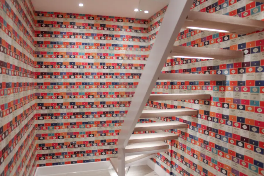 Bold colourful wallpaper up a staircase