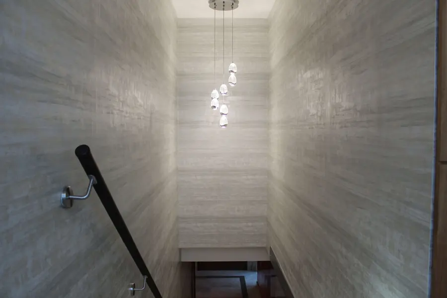 Patterned wallpaper hung up a staircase wall